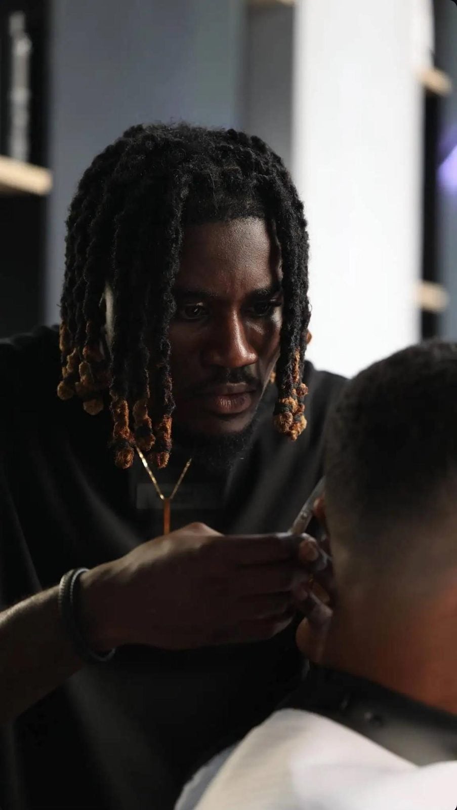 Barber focused on a fresh cut