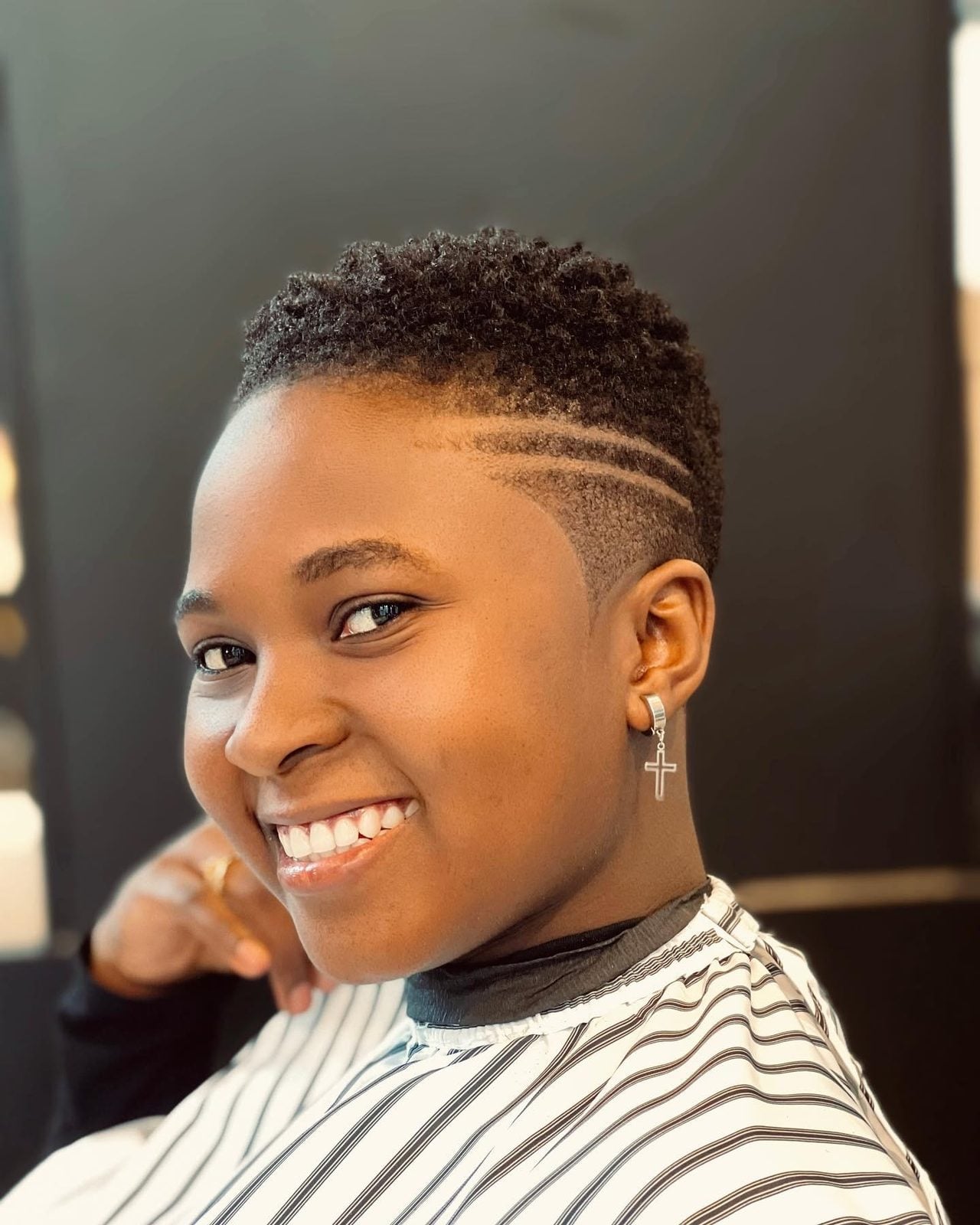Short natural cut with a shaved side design