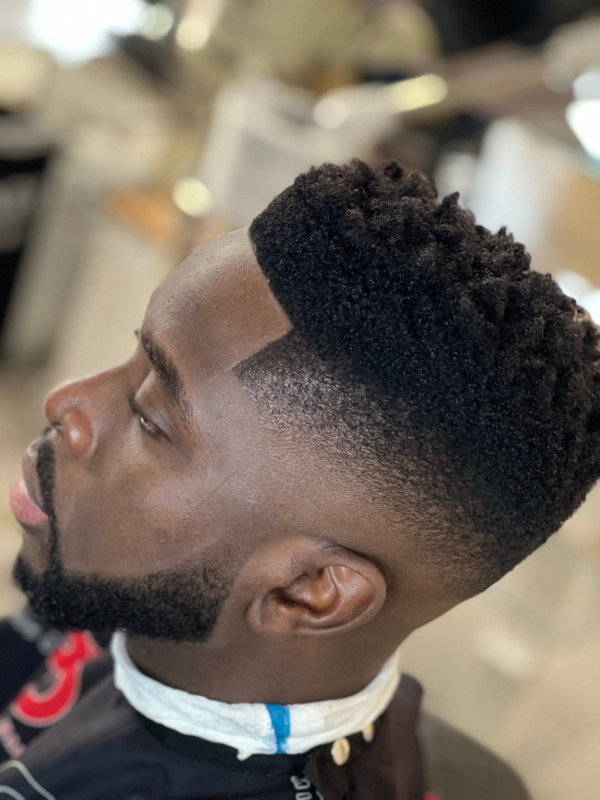Tapered afro with sharp line-up