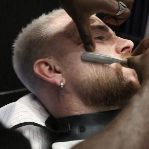 Hot towel shave with a straight razor