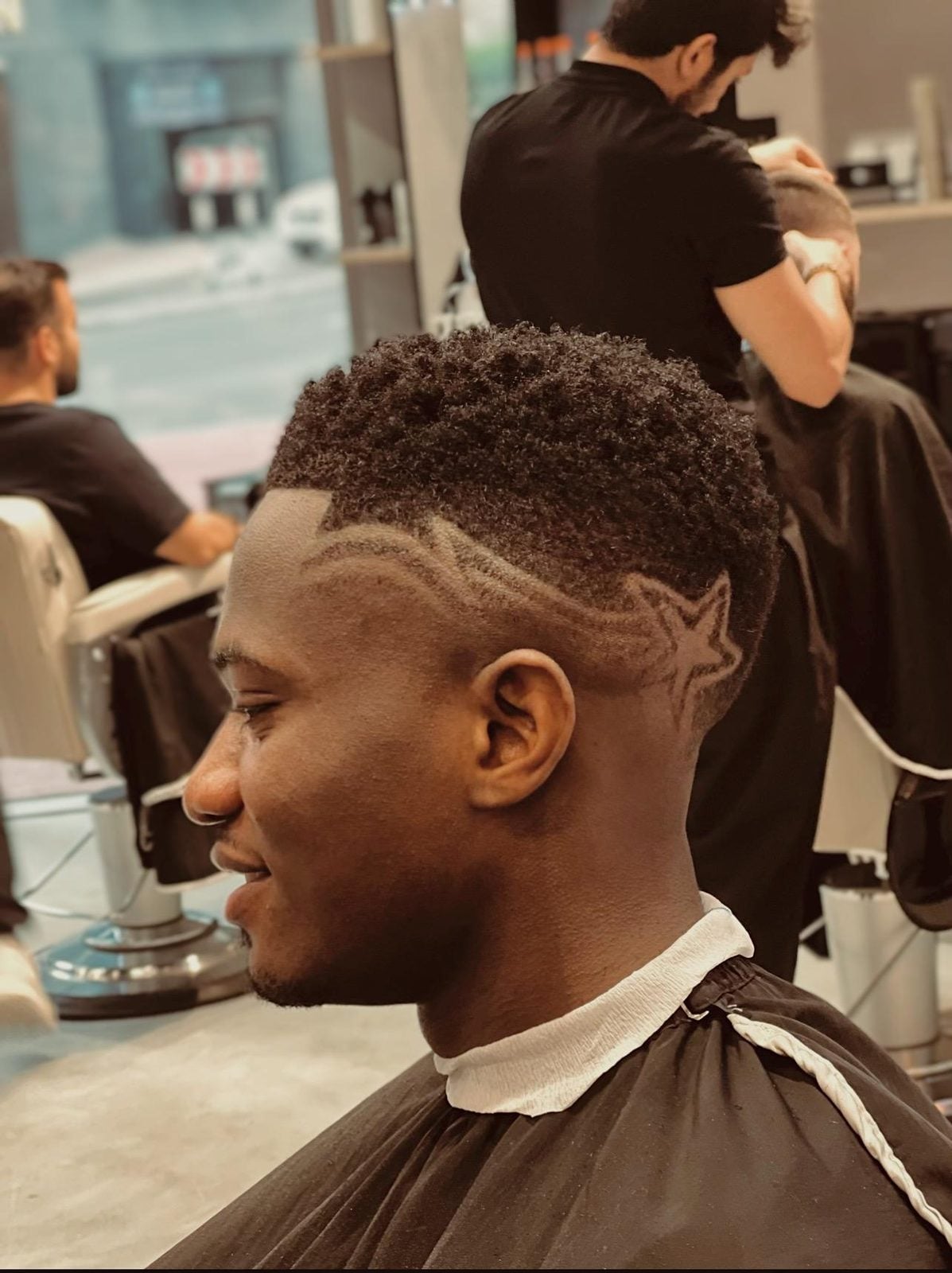 Textured crop with freestyle hair design